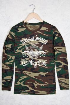 Camo Long Sleeve Tee - Country Girl® Straight Shootin' | Our women's Camo Long Sleeve tee is 100% cotton and features Woodland Camouflage. • 5.5 oz., 100% cotton • Rib collar & cuffs • Double-needle stitched sleeves & bottom hem Color: Green Woodland Camo Country Girl Clothing, Country Mens Fashion, Girls Clothing Stores, Camo Long Sleeve, Country Fashion Women, Country Boy, Country Girls Outfits, Womens Camo, Country Fashion