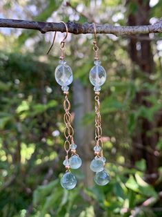 These lovelies are created with Rock Crystal Quartz oval faceted beads accented with faceted rondelle cut Aquamarines which i dropped lengths of 2.8 mm oval long & short link chain with Moss Aquamarine faceted onion briolettes at the bottom. They are made from 14K Rose Gold Fill, have french wire earring components and measure a total length of 3". You will receive the item in these photographs.  Please note that monitors differ in colors but i do my very best to relay exactly how each item is i Faceted Long Drop Jewelry For Anniversary, Faceted Long Drop Earrings For Anniversary, Elegant Faceted Round Bead Crystal Earrings, Elegant Faceted Crystal Dangle Earrings, Briolette Faceted Beads Earrings As Gift, Faceted Beads Briolette Earrings For Gift, Faceted Briolette Beads Earrings For Gift, Wire Earring, Moss Aquamarine