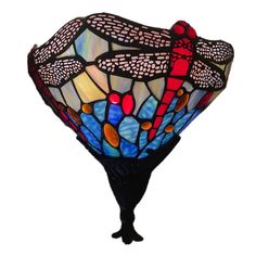 a stained glass lamp with dragonflies on it