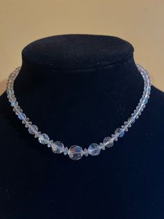 "There are no markings on this elegant crystal choker. It measures 14\"; the catch is a hook. One 3/8\" crystal at the center with smaller round and saucer-shaped crystals gives this choker a unique look. The shipping weight will be 2 ounces." Adjustable Faceted Crystal Necklace, Formal Crystal Necklace With Round Beads, Adjustable Crystal Necklace With Round Beads For Formal Occasions, Adjustable Crystal Necklaces With Round Beads For Formal Events, Adjustable Crystal Necklaces With Round Beads For Formal Occasions, Adjustable Crystal Necklaces For Formal Occasions, Adjustable Crystal Choker, Adjustable Crystal Choker Necklace, Adjustable Clear Crystal Necklaces