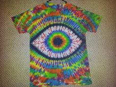 a tie dye shirt with an eye on it