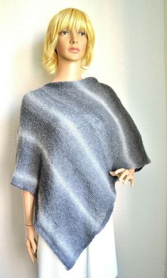 Gray tones, women's poncho handmade from soft, light and little bit fluffy mohair yarn. Warm and cosy. This long poncho will warm you up in chilly evening. Edge facings accurately decorated by hand with crochet hook. Accurately knitted from high quality yarns, so, poncho is durable and easy to maintain. Size: universal, length 58'' (148cm), width 25'' (64cm). Fiber: 28% mohair - 31% polyacrylic - 41% polyamid yarns. Care: hand wash at 30 degrees C. - lay flat to dry. Winter Mohair Shawl One Size, Winter Knit Poncho, Handmade Oversized Winter Poncho, Winter Handmade Oversized Poncho, Handmade Winter Poncho, One Size Alpaca Poncho, Long Poncho, Womens Poncho, Cute Alpaca