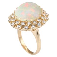 Stamped: 14K Yellow Gold Total Ring Weight: 11.5 Grams Ring Length: N/ARing Width: N/A Gemstone Weight: Total Natural Opal Weight is 10.19 Carat (Measures: 16.60x14.55 mm) Color: Multicolor Diamond Weight: Total Natural Diamond Weight is 1.10 Carat Quantity: 32 Color: F-G, Clarity: VS2-SI1 Face Measures: 24.40x21.45 mm Sku: [703466W] Luxury Opal Ring With 17 Jewels For Anniversary, Luxury Oval Opal Ring With 17 Jewels, Luxury Yellow Gold Opal Ring With Halo Setting, Formal Multi-stone Opal Ring With Diamonds, Formal Multi-stone Diamond Opal Ring, Luxury 14k Gold Round Opal Ring, Exquisite Multi-stone Opal Ring For Formal Occasions, Formal Multi-stone Halo Ring, Luxury Yellow Gold Opal Ring With Round Cut