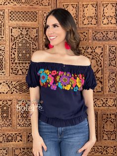 This Beautiful Off the Shoulder Crop Top is the perfect Top for a fun day out or special event. It is comfortable, has elastic around the shoulders, sleeves and waist. This blouse is completely hand embroidered by Mexican Artisans in Chiapas, Mexico making it one of a kind! Note: This blouse comes in one size which fits sizes Small and Medium. Shop the hand painted earrings modeled here: https://www.etsy.com/es/listing/802949597/aretes-artesanales-pintado-a-mano-aretes?ref=listings_manager_grid Multicolor Embroidered Summer Tops For Fiesta, Multicolor Bohemian Tops For Fiesta, Casual Embroidered Top For Fiesta, Bohemian Tops For Summer Fiesta, Bohemian Summer Tops For Fiesta, Bohemian Embroidered Top For Fiesta, Bohemian Short Sleeve Top For Fiesta, Multicolor Folk Tops For Cinco De Mayo, Folk Style Multicolor Tops For Cinco De Mayo