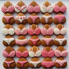 cookies decorated like bikinis and panties are arranged on a plate