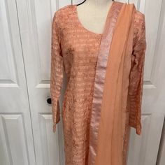 Pakistani Indian Three Piece Beautiful Formal Suit.Brand Bareeze Color Peach.Brand New.Sz Approximately Bust 21.5”Waist 18”Arm 22.5”Length 38.5”Hip 21.5”Shalwar 38” Elegant Unstitched Peach Set, Peach Anarkali Dress For Party, Elegant Peach Unstitched Set, Traditional Fitted Peach Dupatta, Fitted Peach Dress With Dupatta, Elegant Peach Sets For Eid, Elegant Fitted Pink Salwar Kameez, Fitted Peach Kurta For Festive Occasions, Fitted Silk Dupatta For Spring