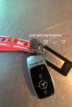 a car keychain with a mercedes tag attached to it