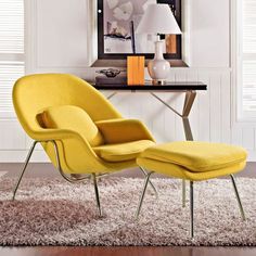 a yellow chair and ottoman in a room