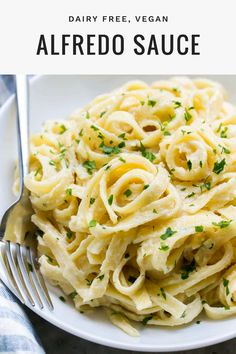 a white plate topped with pasta and parsley