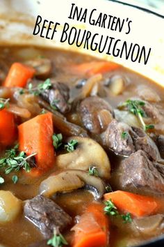 beef stew with carrots, mushrooms and parsley in a pot