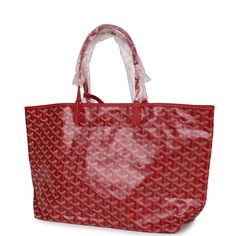 This St. Louis PM tote is in Red Goyardine canvas with silver tone hardware and features red leather handles and trim, removable pouch and white stitching.The interior is lined with white canvas.Origin: FranceCondition: New and never wornAccompanied by: Goyard dustbag, felt, carebook, and removable pouchMeasurements: 13.3" x 11" x 6"; 7" shoulder strap Red Coated Canvas Top Handle Shoulder Bag, Red Top Handle Shoulder Bag In Coated Canvas, Red Travel Bags With Palladium Hardware, Red Luxury Bags With Leather Handles, Luxury Red Bags With Leather Handles, Luxury Large Capacity Red Shoulder Bag, Red Coated Canvas Shoulder Bag For Shopping, Red Tote Bag With Palladium Hardware, Red Tote Shoulder Bag With Palladium Hardware