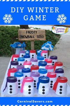 a table topped with lots of frosty cups and snowman faces on it, next to a sign that says diy winter game