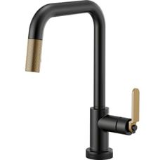 the black faucet with gold handles is shown in front of a white background