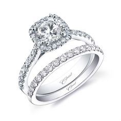 a white gold engagement ring with diamonds on it