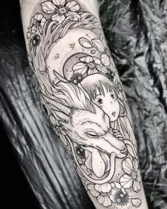 a woman's arm with an animal and flowers tattoo on the left forearm, in black and white