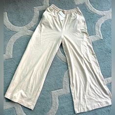 These Ivory 100% Cotton Z Supply Crop Pants Are Super Comfortable And Light Weight! This Wide Leg Style At 26” Inseam, With A 12.5” High Rise And 12” Stretchy Waist Is Sure To Be Perfect For Any Dress Up Or Lounging Around Occasion!! Cream Bottoms With Elastic Stretch Waistband, Cream Stretch Bottoms With Elastic Waistband, Beige Stretch Cotton Wide Leg Pants, Cream Cotton Wide Leg Ankle-length Pants, Summer Beige Sweatpants For Loungewear, Stretch Neutral Bottoms For Loungewear, Beige Straight Leg Loungewear Bottoms, Neutral Wide-leg Loungewear Pants, Neutral Straight Pants For Loungewear