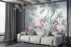 a living room with two flamingos on the wall and a chandelier hanging from the ceiling