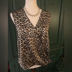 New With Tags Joie Sleeveless Leopard Print Faux Wrap Top Drapes At The Waist And Has A Bit Longer Back For A Front Tuck Type Look. Size Medium. Fabric Has A Great Feel 97% Polyester 3% Spandex. Approx 20” Pit To Pit. (Pictured With Anne Klein Necklace Also Available In My Closet) Sleeveless Brown Tops For Night Out, Brown Sleeveless Top For Night Out, Elegant Sleeveless Leopard Print Tops, Elegant Sleeveless Brown Tops, Chic Brown Vest Top, Chic Brown Tank Vest, Chic Leopard Print Cami Top, Chic Leopard Print Sleeveless Top, Sleeveless Leopard Print Top For Night Out