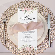 a table setting with place cards and silverware on it, along with a menu