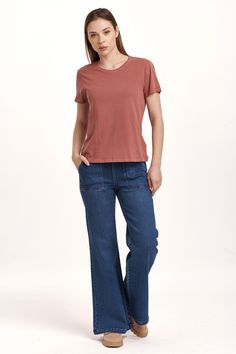 image of a female model wearing a UNITY SHORT SLEEVE JERSEY TEE INTENSE RUST DEAR JOHN DENIM Casual Medium Wash Crew Neck Top, Relaxed Fit Soft-washed Medium Wash Tops, Solid Basic Washed T-shirt, Basic Solid Color Washed T-shirt, Soft-washed Solid T-shirt For Casual Gatherings, Washed Cotton T-shirt For Casual Gatherings, Medium Wash Cotton Crew Neck T-shirt, Relaxed Fit Medium Wash Cotton Tops, Solid Color Washed Cotton T-shirt