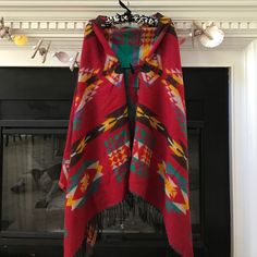 Amazing Never Worn Poncho. Red One-size Cape Shawl, Red One-size Poncho Cape, Red One-size Cape Poncho, Red One Size Cape Poncho, Red Poncho For Beach In Fall, Red Poncho For Festival In Fall, Bohemian Red Shawl Cape, Red Fall Festival Poncho, Red Bohemian Shawl Cape