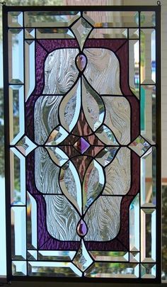 a stained glass window sitting on top of a table