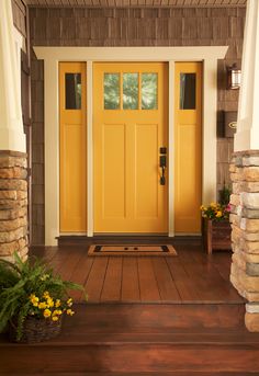 a yellow front door on a house