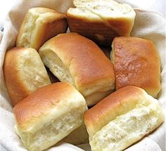 a basket filled with lots of white bread