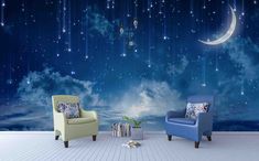 two chairs and a table in front of a night sky wall mural