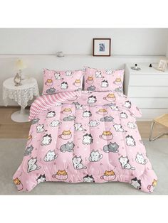 a pink bed set with cats and kittens on it