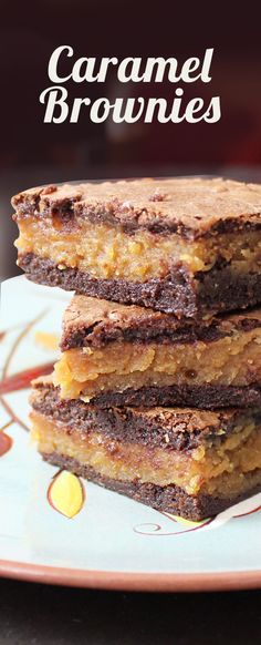 chocolate caramel brownies stacked on top of each other