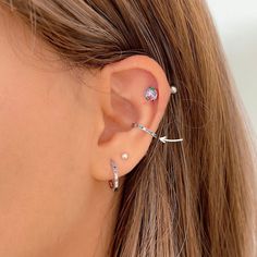 Add some extra bling and color to your ear party with this stunning rainbow conch ear cuff. No piercing is needed as this earring hugs your ear from both sides as shown in the pictures. This ear cuff is made from Sterling Silver (with a '925' stamp of authenticity on the inside of it) and is set with tiny cubic zirconias around its outer front edge. The colors alternate between clear, pink, green, and blue. It is an elegant yet youthful earring that is suitable for daily wear or special occasion Trendy Cubic Zirconia Single Cartilage Earring, Ear Cuff Earrings, Ear Party, Wrap Earrings, Earrings Colorful, Fake Piercing, Rainbow Jewelry, Ear Cuff Earings, Cz Earrings