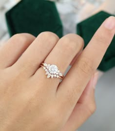 a woman's hand with a diamond ring on it