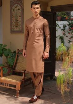 Details : Casual Suit For Men, With Textured Embroidery On Collar And Cuff Color: Rust Fabric : Blended Country of Origin : Pakistan Care Instruction : Should be washed in gentle cycle and hung to dry. Color may bleed so please be mindful of other items with it. Disclaimer : Actual sizes might be slightly different from the size chart. Traditional Embroidered Semi-formal Sets, Semi-formal Unstitched Suit For Festivals, Semi-formal Long Sleeve Unstitched Suit For Festivals, Semi-formal Embroidered Sets For Eid, Embroidered Semi-formal Sets For Eid, Traditional Long Sleeve Semi-formal Sets, Semi-formal Traditional Wear With Resham Embroidery, Semi-formal Embroidered Traditional Wear, Fitted Brown Sets For Eid