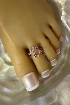 This toe ring features a shiny silver branch that wraps around the toe. Three petite pink crystal flowers and three clear crystal accents sit on the branch that also adorn the toe. This toe ring is size adjustable and one size fits most. Comfortable and versatile, it will lend itself to casual or formal events. All items are made in a smoke free environment. *If there is any issue with your toe ring, please let me know so that I can correct it. Thanks for visiting my shop!👣 Columbia Tn, Sterling Silver Toe Rings, 2 Flowers, Ring Crystal, Silver Toe Rings, Ring Flower, Toe Ring, Foot Jewelry, Crystal Flower