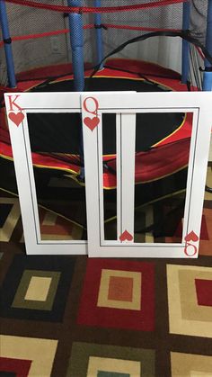 an image of a white window with playing cards on the side and red arrows pointing up