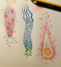 pencils are laying on top of paper with drawings and stars in the sky around them