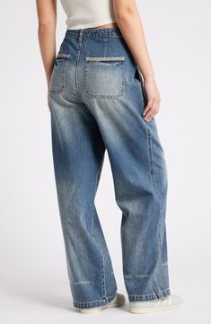 These baggy, high-waist jeans are designed with edgy rips, stitching detail and dramatic wide legs. 31" inseam; 22" leg opening; 13 1/2" front rise; 17" back rise (size 29) Zip fly with button closure 70% cotton, 30% Tencel® lyocell Tencel lyocell is a more-sustainably produced fiber made with closed-loop processing Machine wash, tumble dry Five-pocket style Imported Baggy Wide Leg Cargo Jeans In Faded Color, Baggy Faded Wide Leg Cargo Jeans, Faded Baggy Wide Leg Cargo Jeans, Faded Baggy Wide-leg Cargo Jeans, Relaxed Fit Distressed Medium Wash Flare Jeans, High Waist Distressed Cotton Flare Jeans, Relaxed Fit Distressed Flare Jeans In Medium Wash, Casual Distressed Flare Jeans In Rigid Denim, Medium Wash Relaxed Fit Distressed Flare Jeans