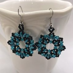 Handmade Earrings Featuring Ocean Blue Czech Glass Superduo Beads With Matte Black Seed Beeds And Swarovski Crystals. These Are Hand Stitched, Beaded Earrings For Pierced Ears With Hypo-Allergenic Ear Wires. They Are 1 1/4” Diameter And Drop 2 1/4”. These Were Made From A Pattern Shared Courtesy Of Beadsmagic.Com. Lightweight. One Of A Kind. Unique. New, Never Worn. Black Beaded Round Earrings For Party, Black Beads Round Earrings For Party, Black Round Earrings With Colorful Beads, Black Earrings With Colorful Beads, Superduo Beads, Black Seed, Swarovski Crystal Earrings, Bead Embroidery, Ocean Blue