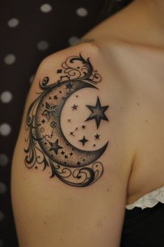 a woman with a crescent and stars tattoo on her shoulder