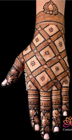 the hand is decorated with intricate designs