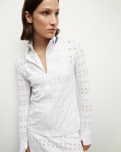 A lightweight summer jacket for on and off the court. Made from 4-way stretch pointelle lace, this tennis-inspired style features a stand collar, a front zip, curved seams and reflective navy trim. Wear with a ruffled skirt and sneakers for everyday chic.Part of our tennis capsule in collaboration with activewear brand L’Etoile Sport.96% Nylon, 4% PolyurethaneCollar and cuff: 72% Nylon, 28% LycraMade in USAMachine wash coldStyle #CT036VB White Stretch Track Jacket For Spring, Cold Style, Skirt And Sneakers, Plus And Minus, Everyday Chic, Activewear Brands, Lace Jacket, Ruffled Skirt, Summer Jacket