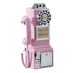 an old - fashioned pink phone is on display against a white background, with the dial panel open