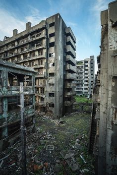 an abandoned building with lots of windows and balconies