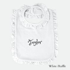 a bib with the word taylor on it and ruffled trimming around the bottom