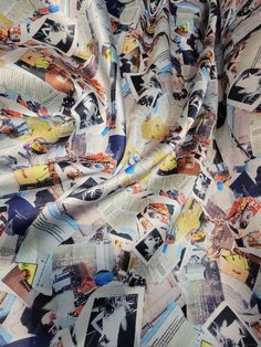 the fabric is covered with newspaper images