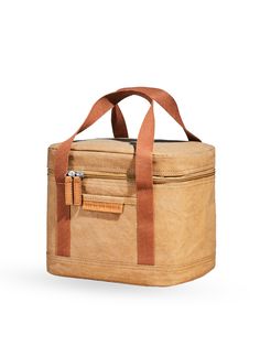 a brown and tan bag with straps on the handle is sitting in front of a white background