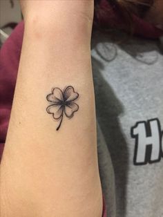 a four leaf clover tattoo on the wrist