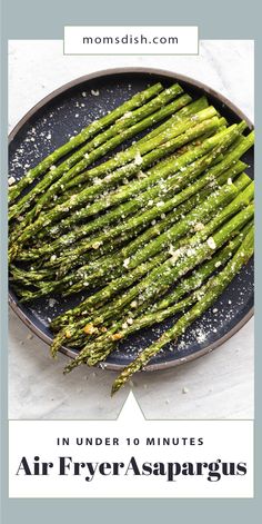 an air fryer asparagus on a plate with the words, air fryer asparagus so easy