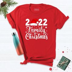 2022 Family Shirt , Family Christmas 2022 Shirt, Christmas Shirt ,Matching Christmas Santa Shirt, New Year Christmas Shirt, 2022 Xmas Shirt. Hi! Welcome to our store. It's good to see you here. Our aim is to offer you first-class clothing in your most beautiful moments with our graphic t-shirts that we designed or designed with your ideas. I am sure you will like our designs for your family, friends and you. IMPORTANT MATTERS FOR ORDERING: 1-) Please check and review all photos. 2-) Our sizes ar New Year Holiday Crew Neck T-shirt, Crew Neck T-shirt For New Year's Holiday, Crew Neck T-shirt For New Year Holiday, Red Letter Print T-shirt For New Year, Red Festive T-shirt With Letter Print, New Year Red Letter Print T-shirt, Festive Crew Neck T-shirt For New Year, New Year Red T-shirt With Graphic Print, Red Graphic Print T-shirt For New Year